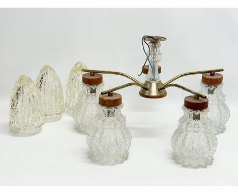 A Mid Century teak and brass ceiling light with glass shades. 48x31cm 