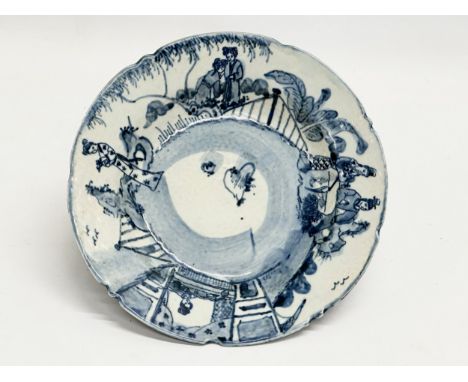 A Chinese blue and white bowl with celadon glazed base. Seal mark. 19.5x4cm 