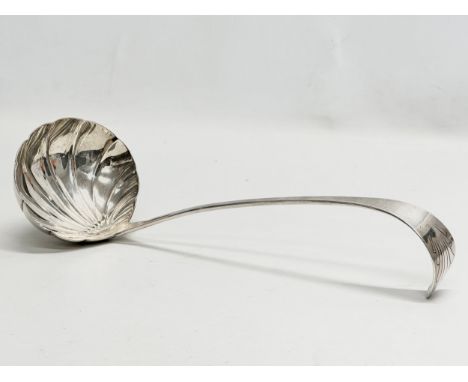 Samuel Neville. An Early 19th Century Irish silver hookend ladle. Dublin. 1812. 30cm. 198g 