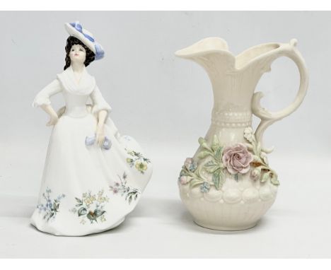 A Royal Doulton ‘Adele’ figurine. Together with a Belleek pottery jug. 21cm. 