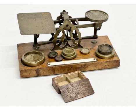 A set of Late 19th Century postal scales and weights. With a wooden postage stamp box. 21.5x11x10cm 