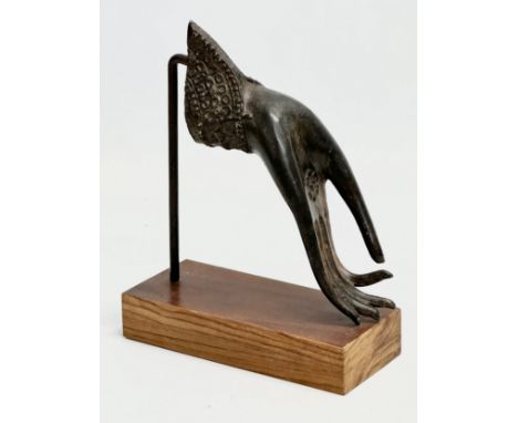 An Early 20th Century Indian bronze Buddha hand on later rosewood base. 14.5x18.5cm. 