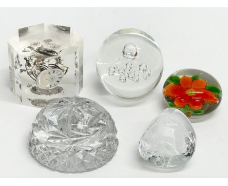 A Pierre Giraudon clock parts lucite paperweight with 4 others. 