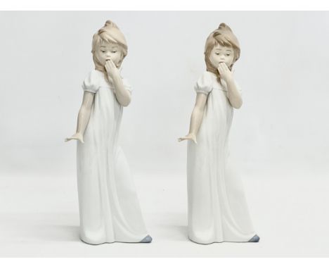 A pair of large NAO ‘Yawning Girl’ figurines. 29.5cm 