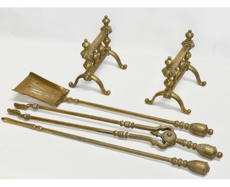 A set of Victorian brass fire andirons and tools. Andirons 21x-6x20cm. Tools 67cm 