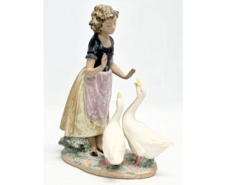 A large NAO ‘Teaching The Geese’ figurine. 23x28cm 