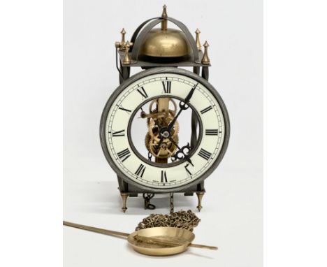 A West German Tempus Fubit skeleton clock. With 1 weight and pendulum. 15x10x25cm 