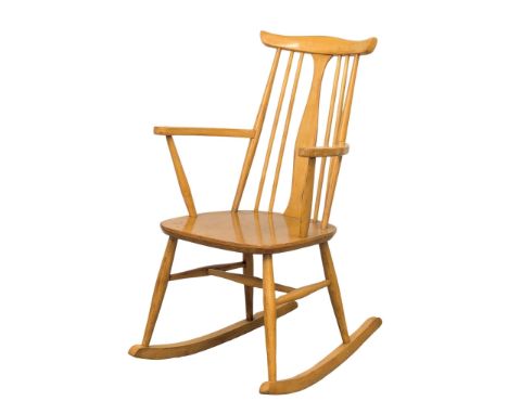 An Ercol style beech rocking chair. 
