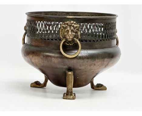 A good quality Late 19th Century William Soutter and son’s Soutterware copper jardiniere /planter, with 3 brass lion masks ri