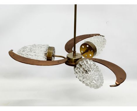 A 1960’s Mid Century teak ceiling light with glass shades. 57x48cm. 