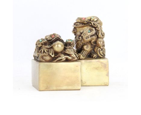Two contemporary Chinese solid cast brass dragon desk seal, set with turquoise and coral eyes