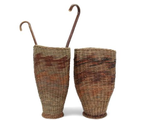Two rattan baskets, of circular abstract form, together with two crook walking stick, basket H62cm 