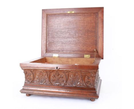 19th century Continental mahogany and oak box, carved in high relief with classical figures, harp, musical trophies, anthemio