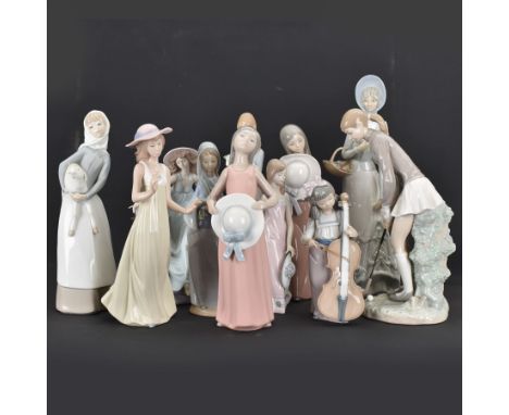 Group of Lladro figures, to include May Dance no 5662, examples modelled as a female golfer, young woman holding sheep in her