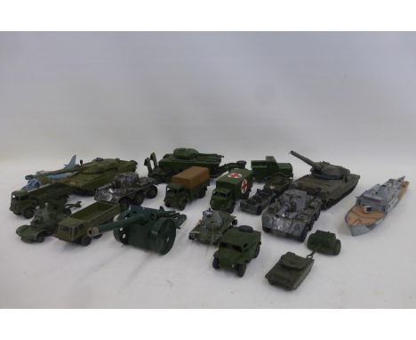 A box of military die-cast models including a Dinky ambulance, a field artillery tractor, an army wagon etc.