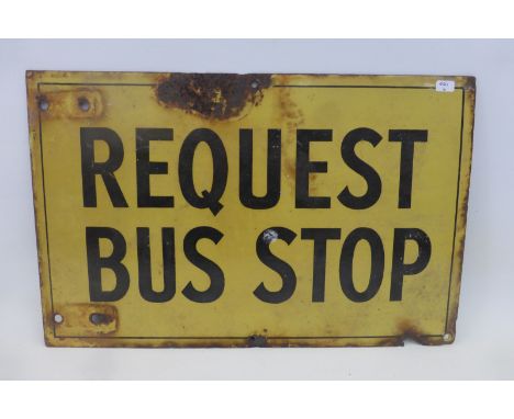 A Request Bus Stop rectangular enamel sign, 16 3/4 x 10 3/4".