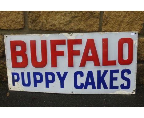 A Buffalo Puppy Cakes shaped enamel sign, 28 x 13 3/4".