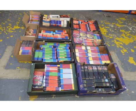 An extensive collection of Harry Potter volumes by J.K. Rowling, many first editions.