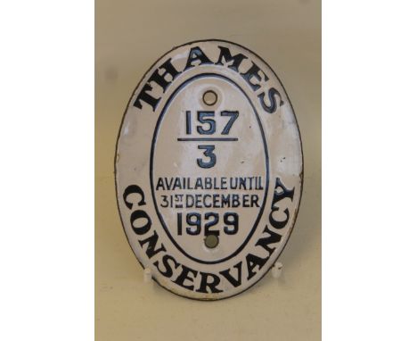 A Thames Conservancy oval black and white enamel plaque - "available until 31st December 1929", 3 1/4 x 4 1/2".