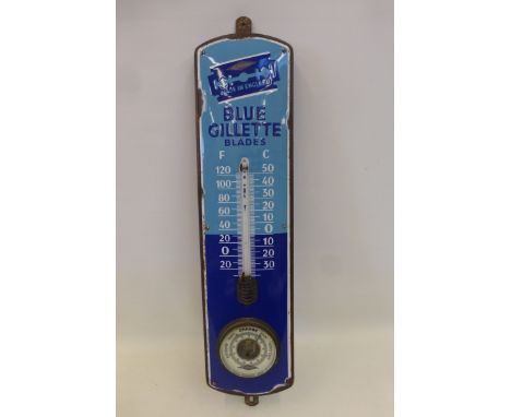 A rare Gillette Blue Blades enamel thermometer with integral barometer, set on a wooden backing, 6 1/2 x 27 1/2" overall.
