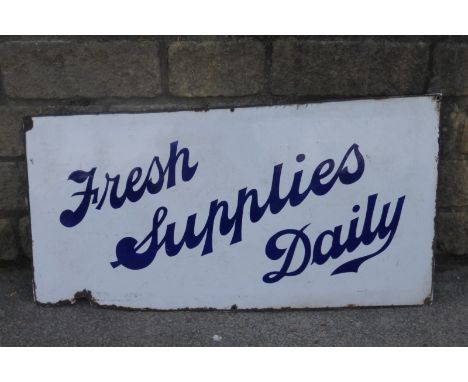 An enamel sign - "Fresh Supplies Daily", 39 3/4 x 21".
