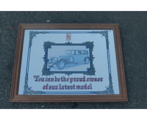 A decorative Rolls-Royce "You can be the proud owner of our latest model" advertising mirror, 26 3/4 x 21".
