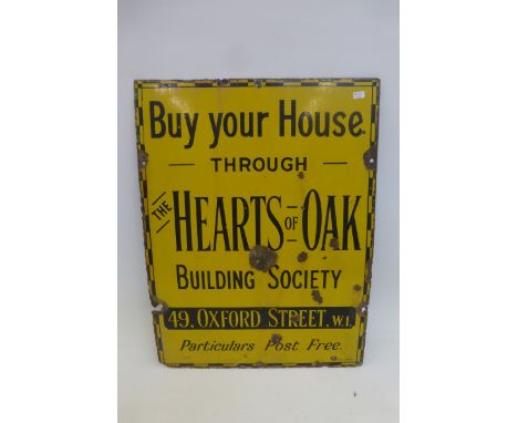 A "Buy Your House through The Hearts of Oak Building Society" rectangular enamel sign, 15 x 26".