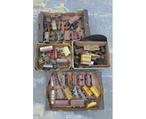 Five boxes of mostly Hornby 0 gauge model railway pieces of rolling stock, layout, track, tinplate buildings etc.