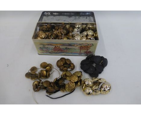 A box of assorted military regimental buttons including the Wiltshire Regiment, The Royal Marines, the Duke of Cornwall's Lig