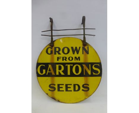 A Gartons Seeds circular double sided enamel sign with original metal bracket, 16" diameter.