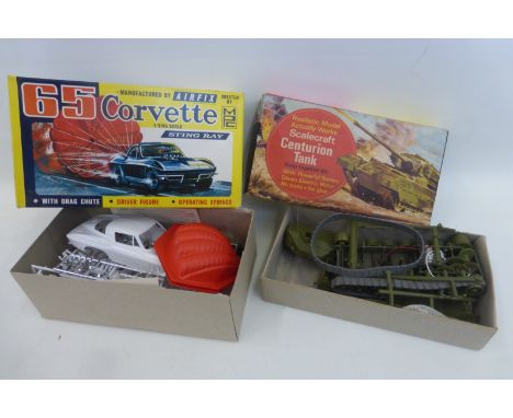 A boxed Airfix 1'25th scale model of a "65 Corvette Sting Ray", made by Model Products Corp. USA and a boxed Scalecraft Kits 