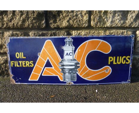 An AC Plugs and Oil Filters retangular enamel sign, 30 x 12".