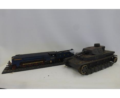 A large model of a WWII German Panzer Tank and a model of an L.N.E.R. 2001 steam engine and tender.