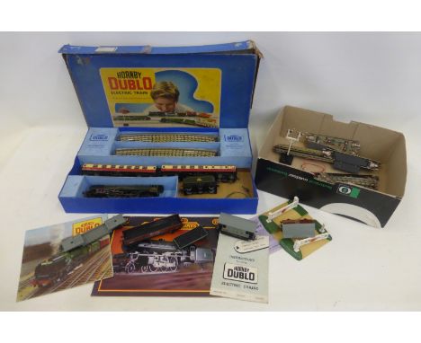 A Hornby Dublo three rail tinplate "Passenger Train Set No. ED12", with a Hornby Dublo sales leaflet, an instruction leaflet 
