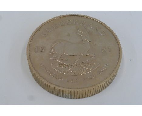 An oversized krugerrand shop display model.