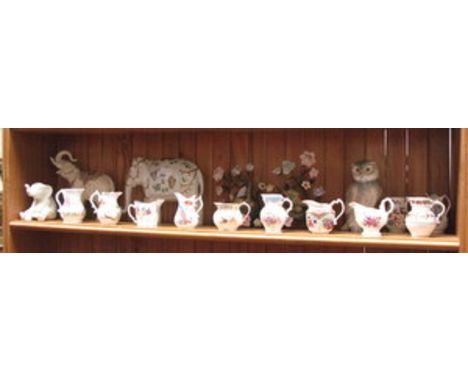 THREE VARIOUS CERAMIC ELEPHANTS, NAO OWL, PAIR OF WALL MOUNTING CERAMIC BIRDS IN GILT SETTINGS PLUS VARIOUS CERAMIC JUGS 