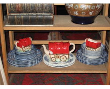 PARCEL OF BLUE AND WHITE DINNERWARE AND THREE PIECE CERAMIC GYPSY WAGON FORM TEA SET 