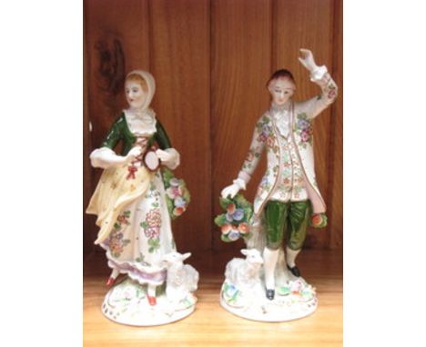 PAIR OF CONTINENTAL STYLE GLAZED CERAMIC FIGURES 
