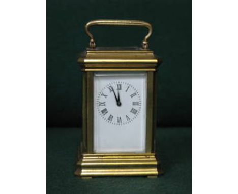 MINIATURE VINTAGE BRASS CARRIAGE CLOCK, APPROXIMATELY 7.5cm HIGH 