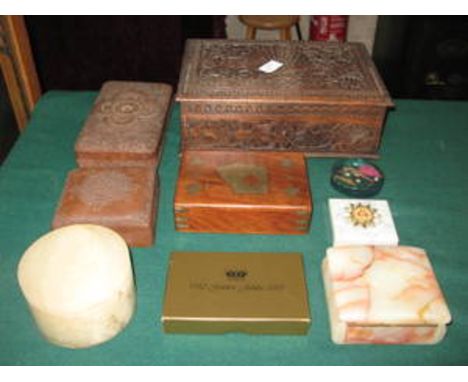THREE HEAVILY CARVED TREEN BOXES, PLAYING CARDS, ETC. 