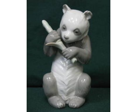 NAO GLAZED CERAMIC FIGURE OF A SAD PANDA, APPROXIMATELY 18cm HIGH