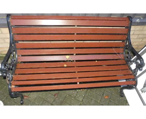 A black painted cast metal ended and stained timber slatted two-seater garden bench, width 132cm