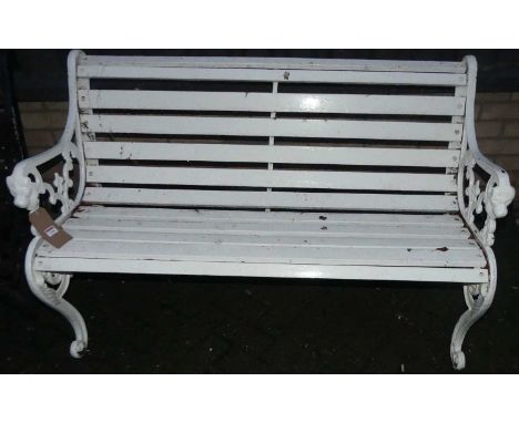 A white painted cast metal ended and white timber slatted two-seater garden bench, width 132cm