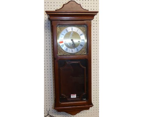 A contemporary Metamec drop trunk wall clock, with pendulum