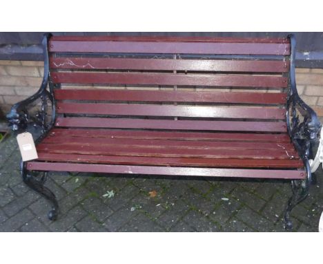 A black painted cast metal ended and stained timber slatted two-seater garden bench, width 132cm