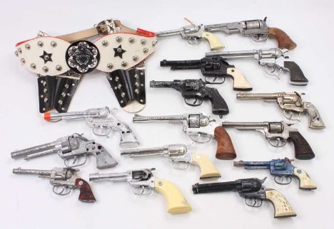 15 1950s and later children's cap guns and pistols to include a Roy Rogers Hubley Toys pistol diecast plated by Schmidt with 