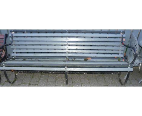 A 19th century black painted wrought iron framed and later grey painted slatted timber four-seater garden bench, width 215cm