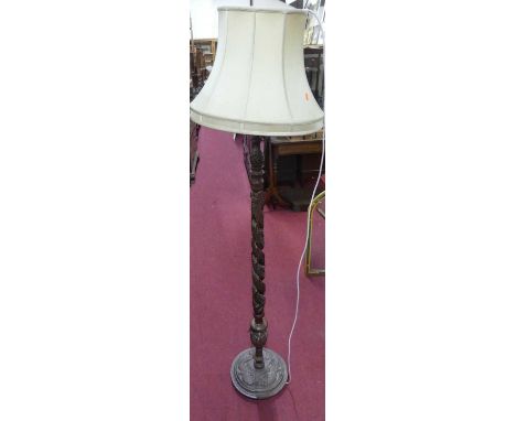 An Eastern relief carved teak standard lamp