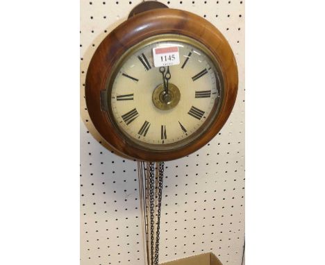 A circa 1900 wall hanging postman's alarm clock, with three weights and pendulum