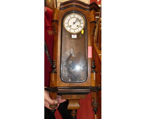 An early 20th century figured walnut and ebonised Vienna drop trunk wall clock (for restoration)